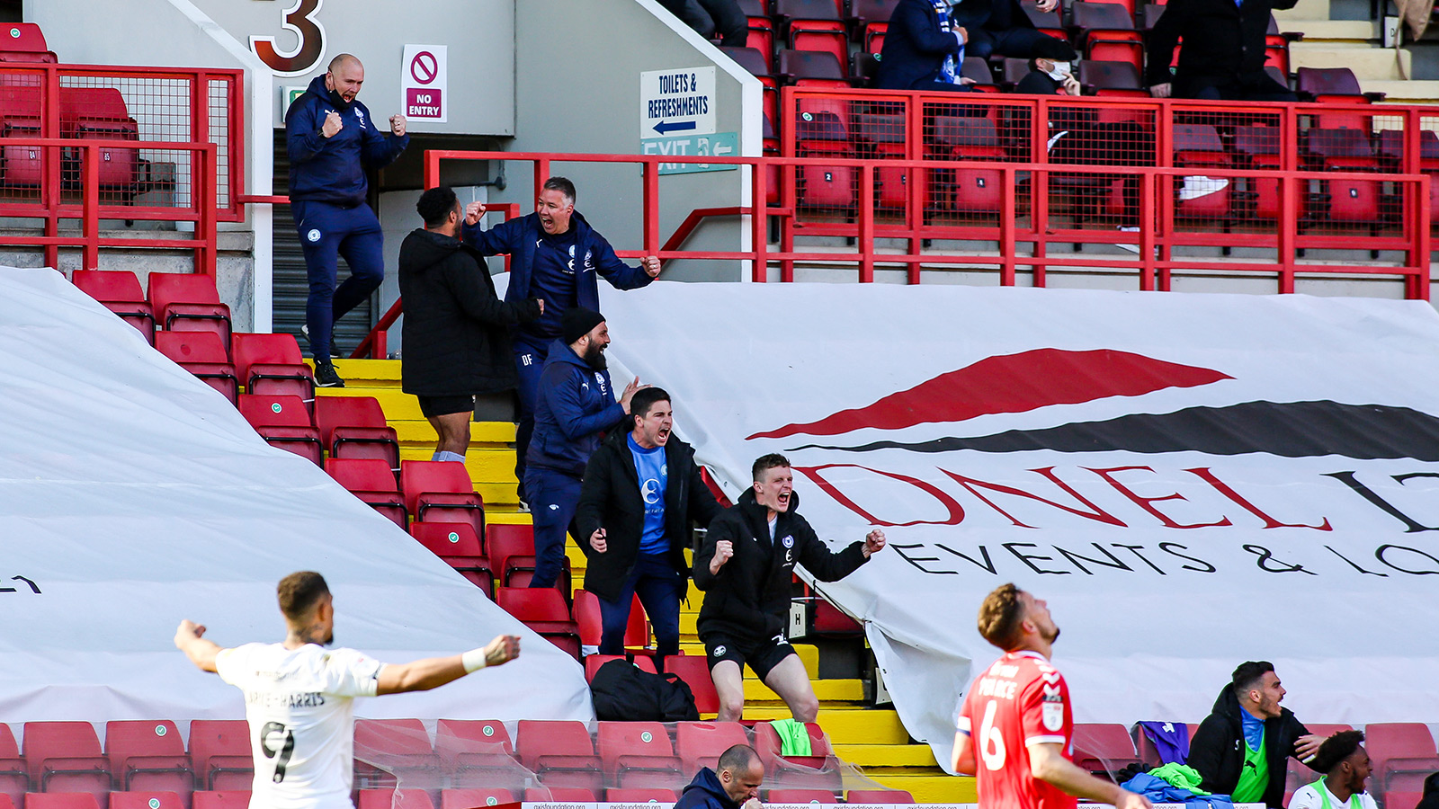24th April '21 | Darren Ferguson celebrates in the stands as Posh record a pivitol victory at Charlton Athletic