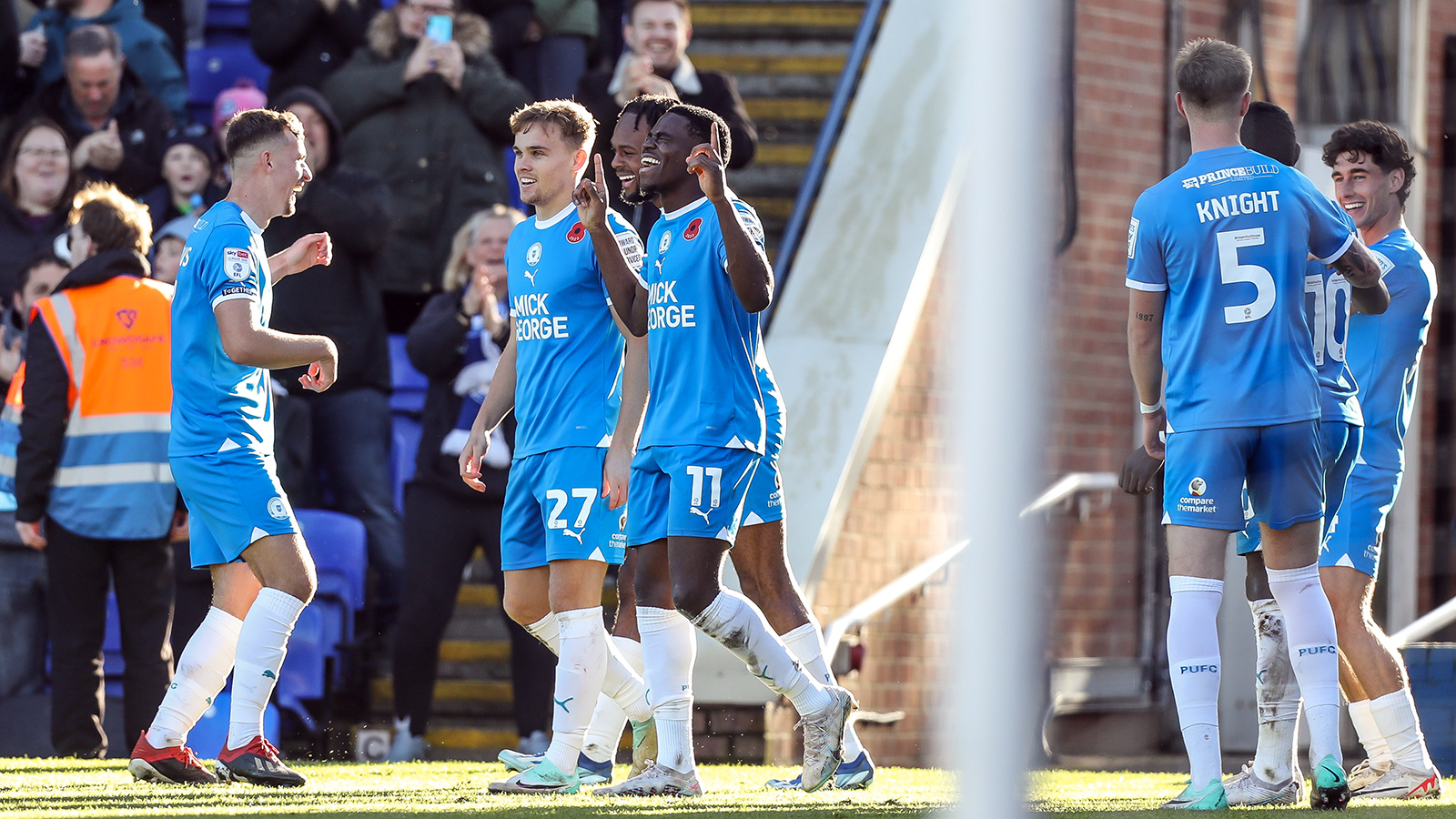 Posh players celebrate during the 5-0 win over Cambridge