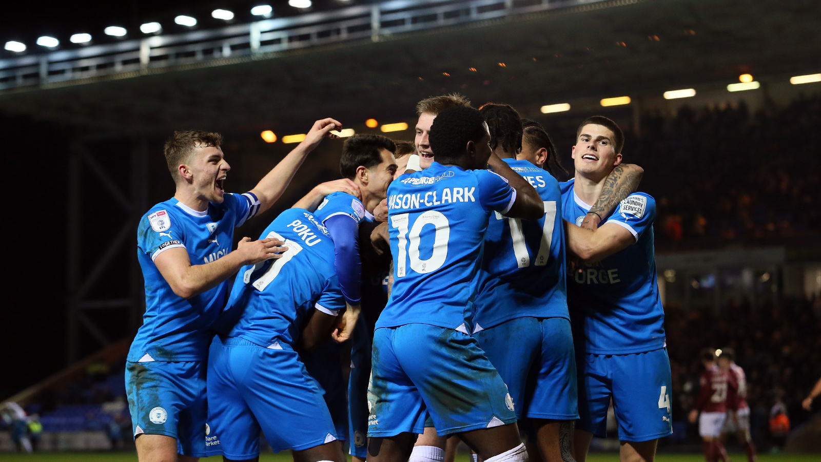 Posh players celebrate during the 5-1 win over Northampton Town