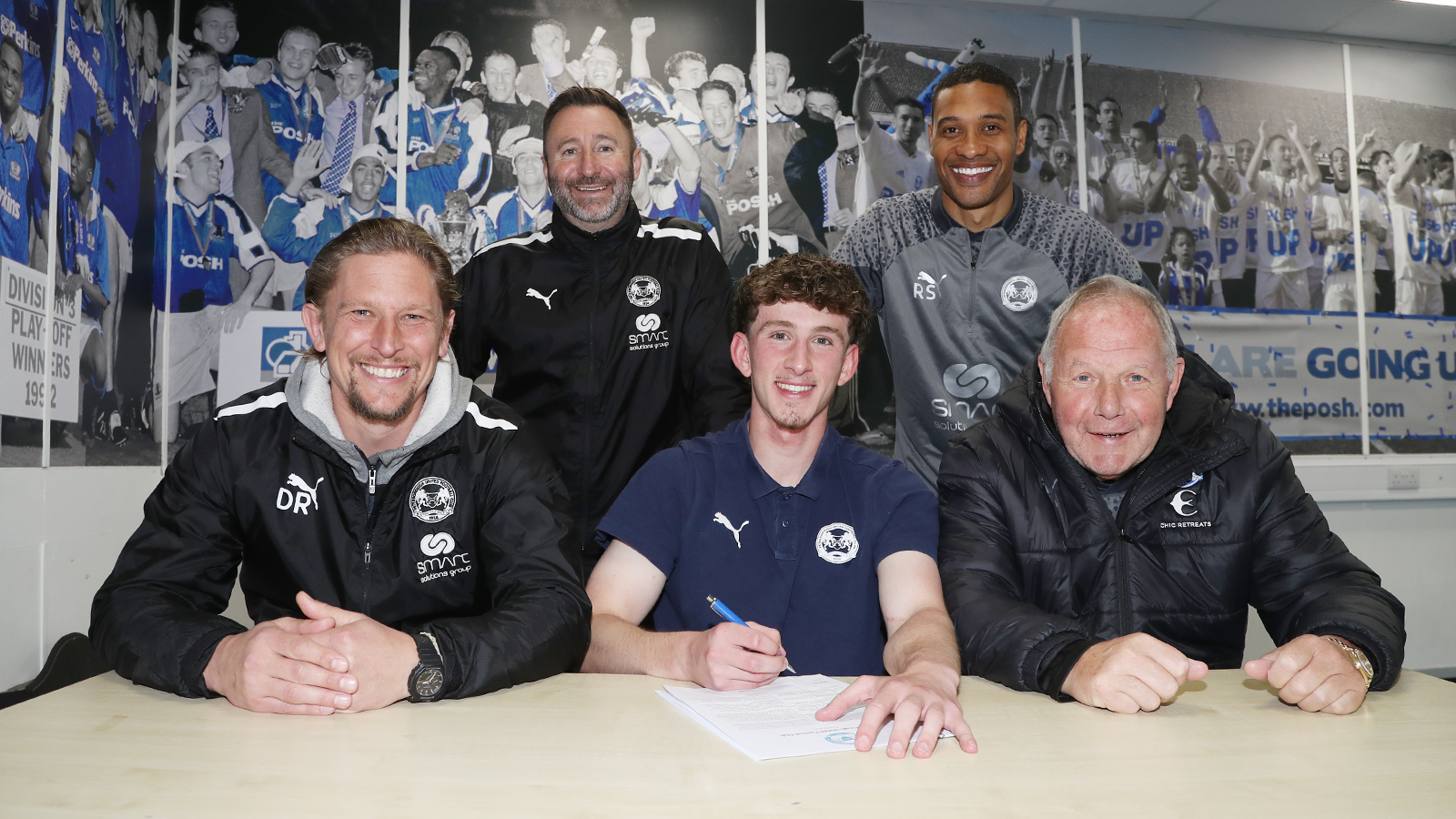 Ollie Rose signing his professional contract