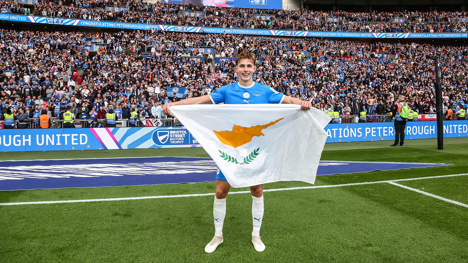 Hector Kyprianou with a Cyprus flag