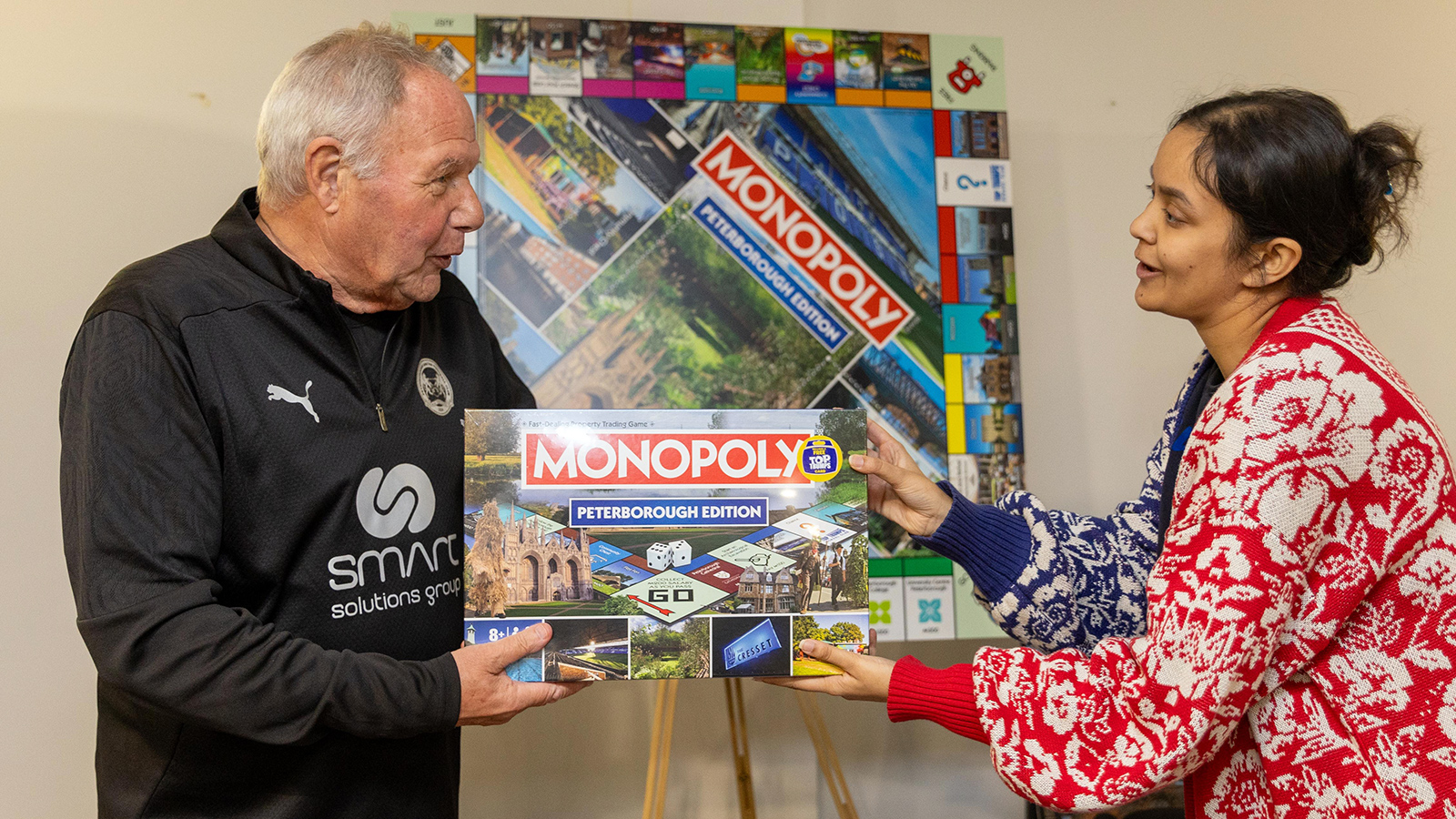 Barry Fry is presented with a game of Peterborough Monopoly