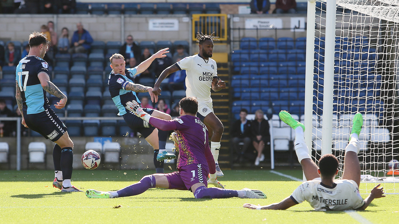 Match action between Posh and Wycombe Wanderers