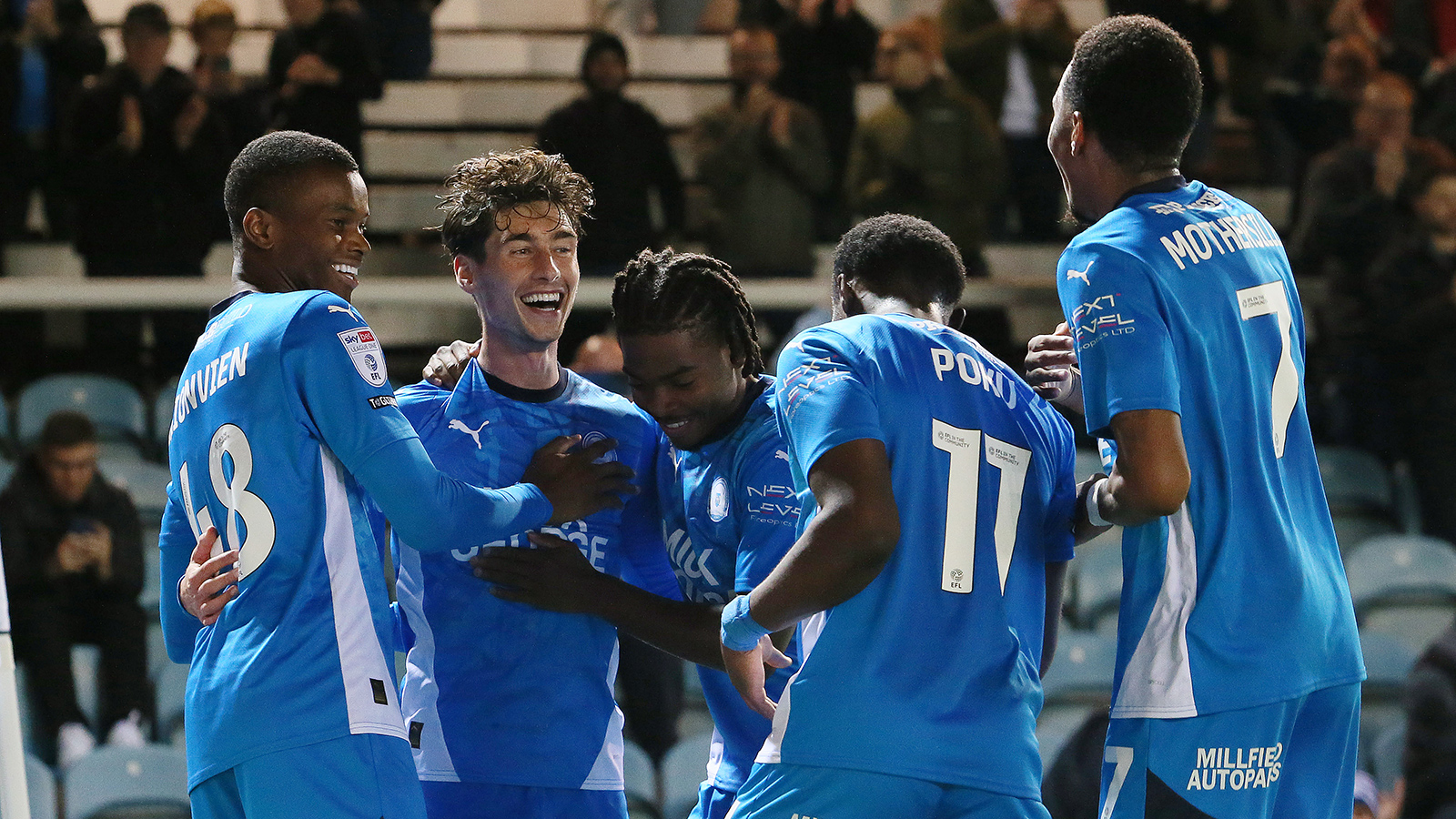 Posh players celebrate scoring against Blackpool