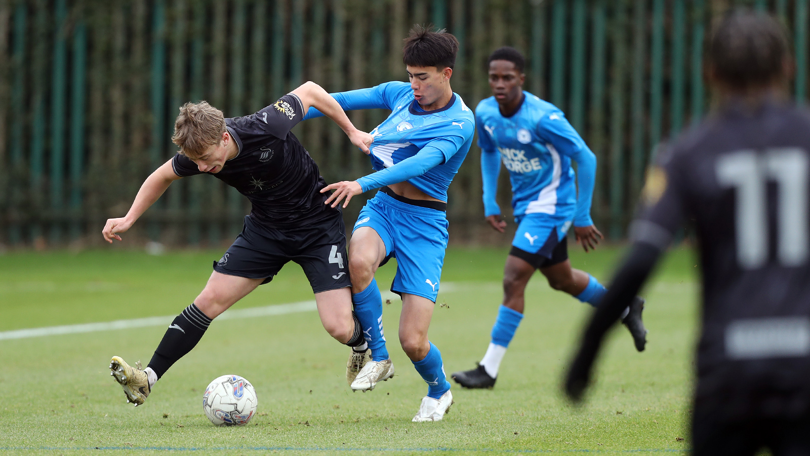 Action between Posh U21s and Swansea City U21s