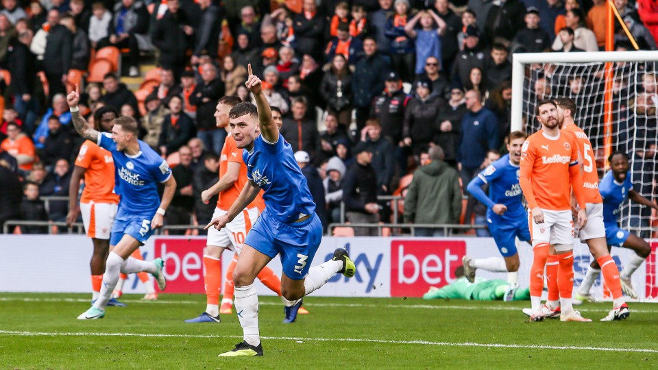 Harrison Burrows celebrates scoring his goal at Blackpool