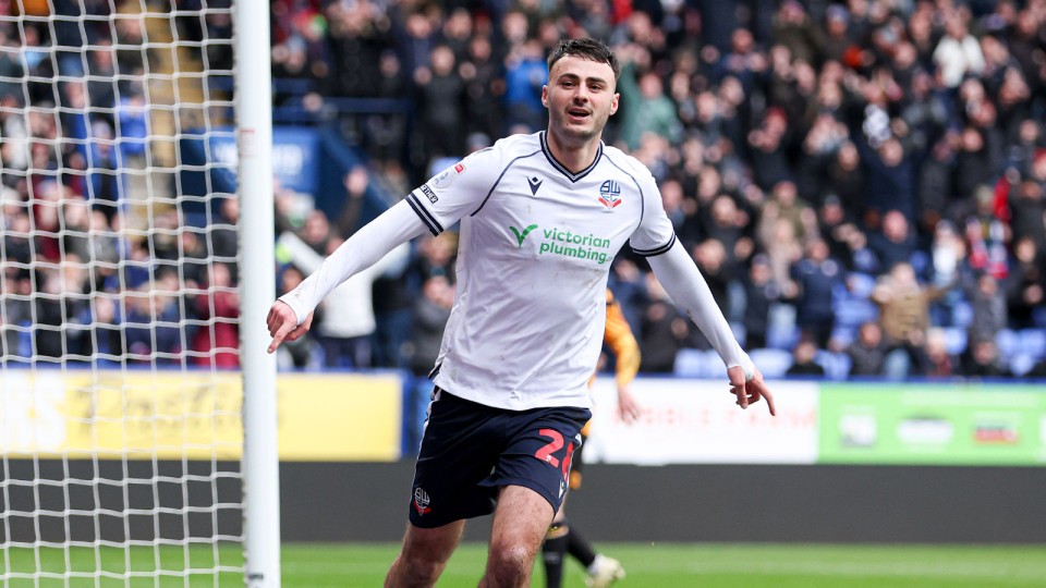 Aaron Collins celebrates scoring against Bolton Wanderers