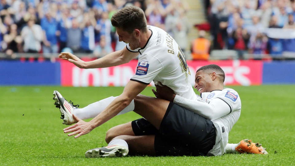 Mark Little celebrates with goalscorer Shaun Brisley
