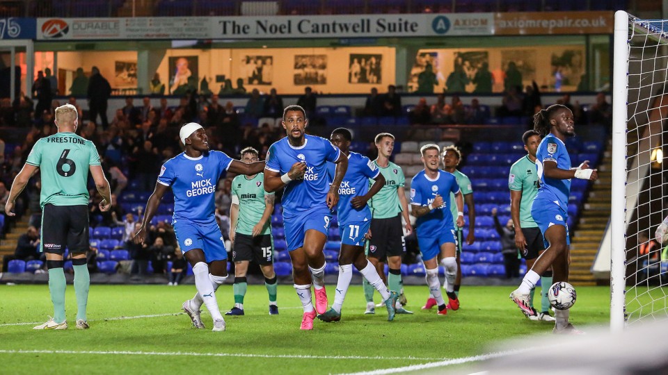 Jonson Clarke-Harris celebrates scoring his goal against Cheltenham Town