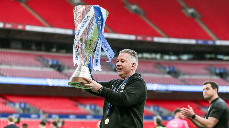 Darren Ferguson lifts the Bristol Street Motors Trophy