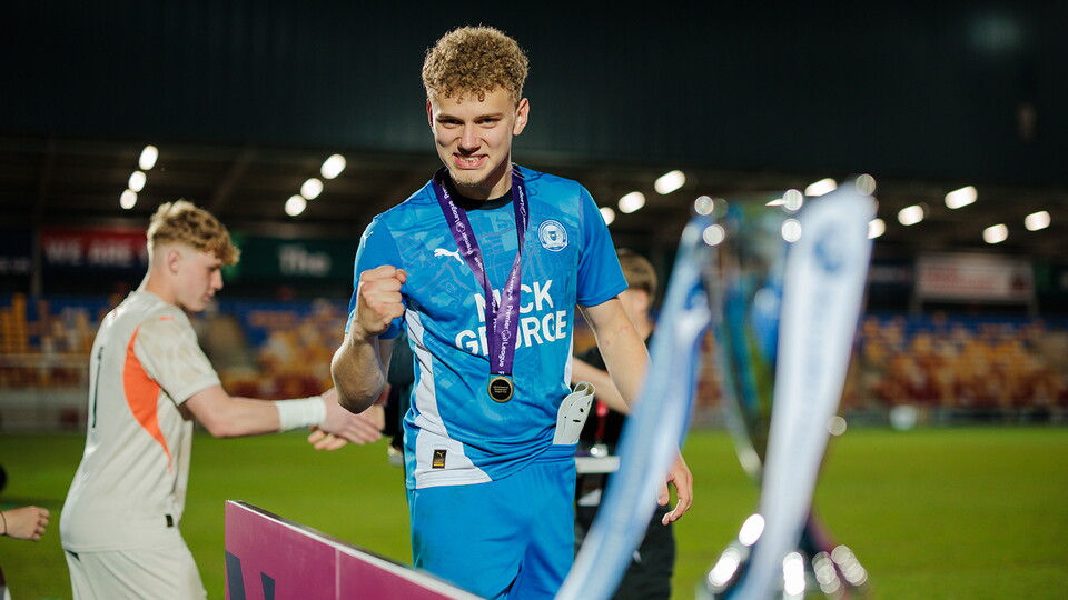 Lucca Mendonca celebrates winning the Under 18s Premier League Cup