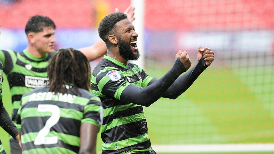 Myles Hippolyte celebrates a goal for AFC Wimbledon