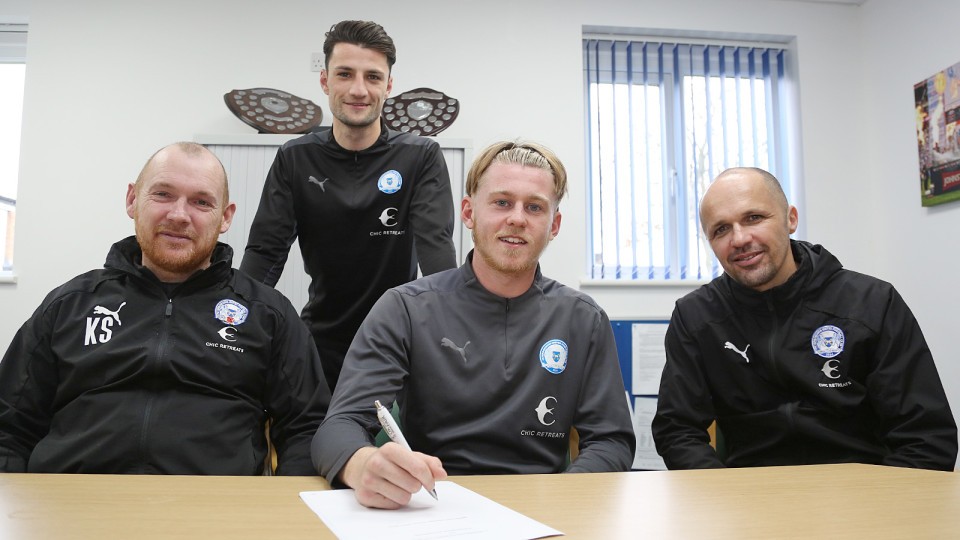 Kellan Hickinson signing his professional contract