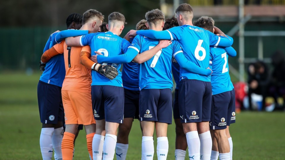 Posh  U18s in a huddle