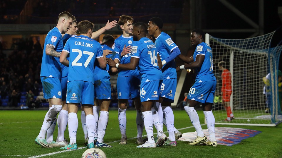 Posh players celebrate scoring against Stevenage