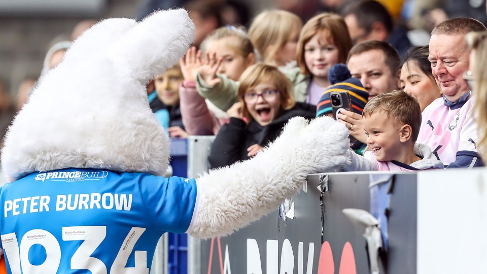 Peter Burrow interacts with young supporters