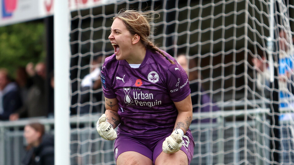 Neive Corry celebrates saving a penalty