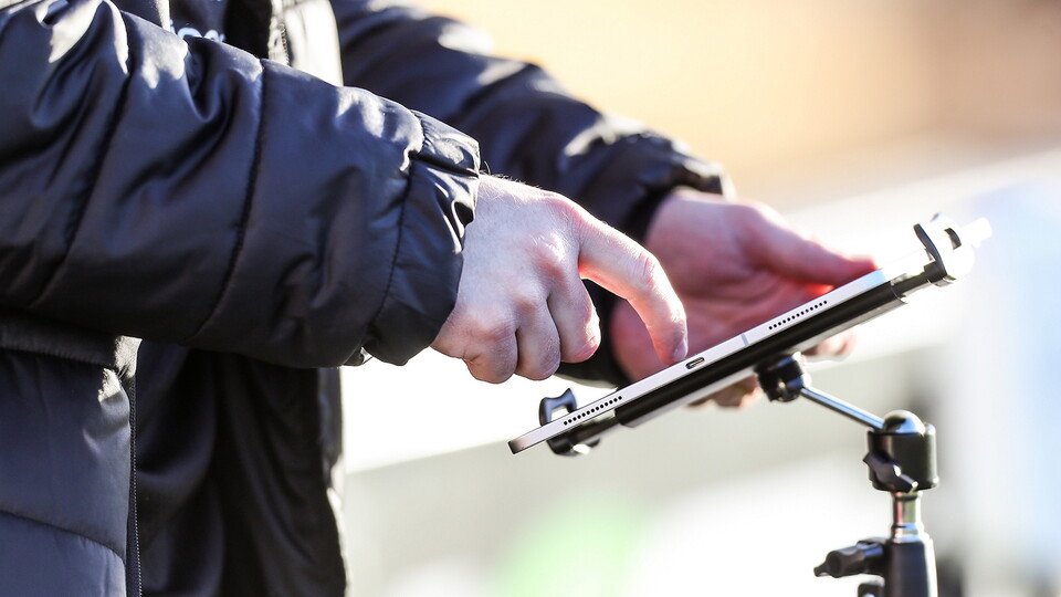 A generic view of a Performance Analyst using an iPad