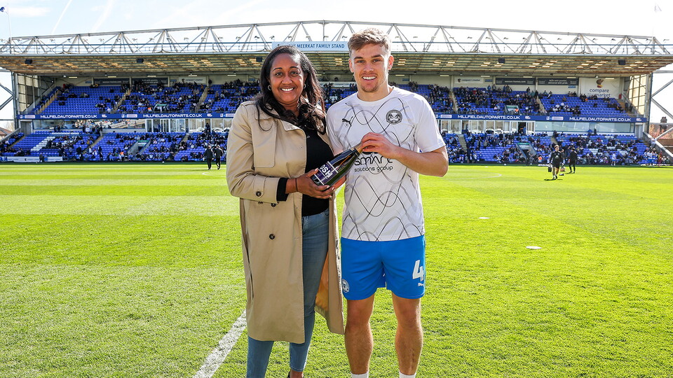 Archie Collins is presetned with the Player of the Month award