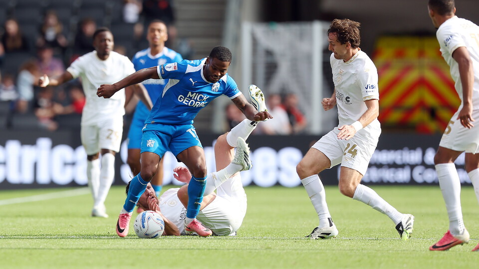 Action between Posh and MK Dons