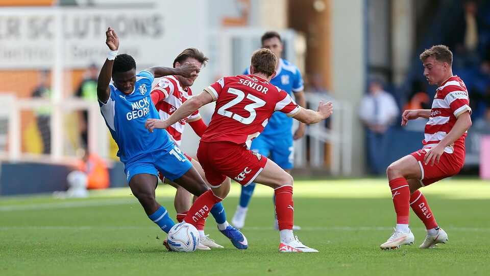 Match action between Posh and Doncaster Rovers