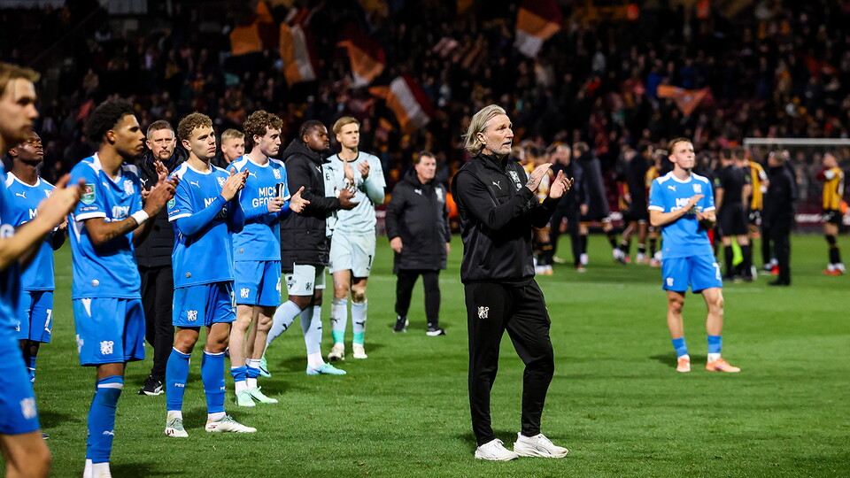 Manager Robbie Savage and players thank the travelling supporters at full-time
