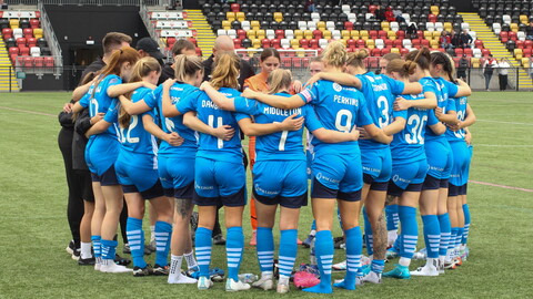 women huddle
