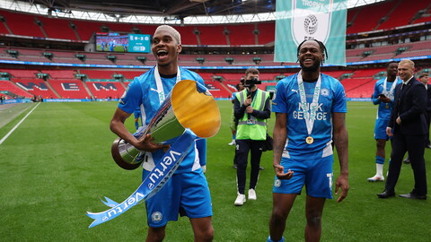 Malik Mothersille and Ricky-Jade Jones with the Vertu Trophy
